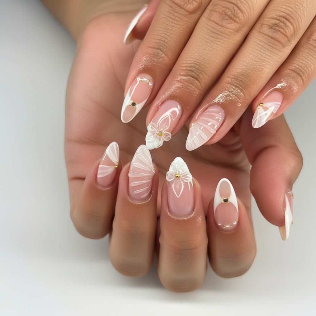 AuraPal French tip press-on nails with 3D white flowers, delicate white swirls, and gold accents.