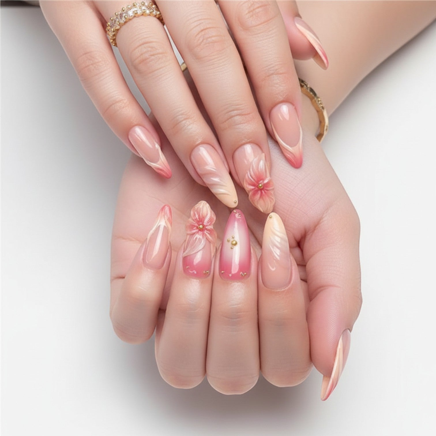 Aurapal Aura29 press-on nails with 3D floral design, pink and nude gradient, gold accents.