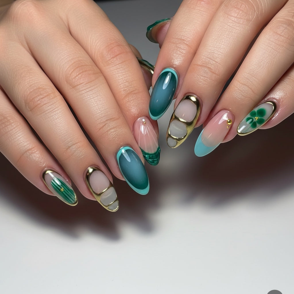 Aurapal Aura32 press-on nails with abstract green and blue designs, gold accents, and clover detail.
