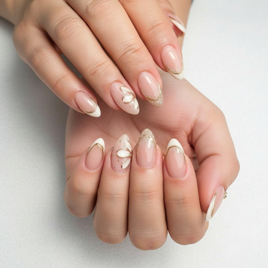 Aurapal Aura45 press-on nails with a nude base, white tips, gold accents, and floral designs.