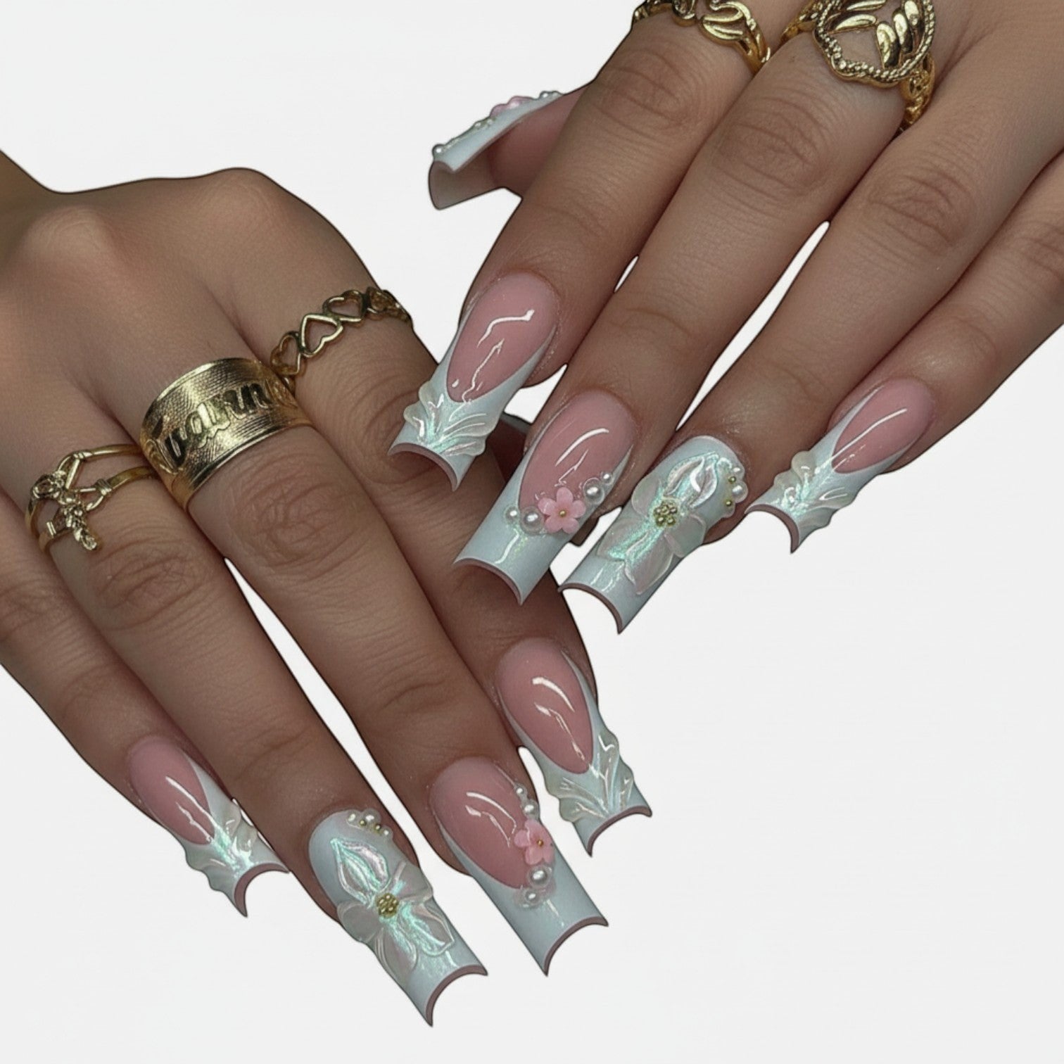 Aurapal Aura59 press-on nails with pink French tips, white 3D floral accents, pearls, and iridescent details.