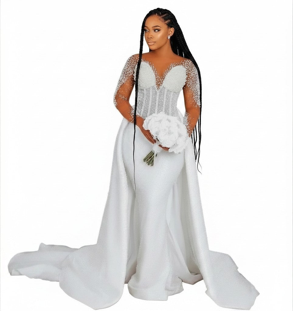 Aurapal white mermaid wedding gown with pearl-embellished bodice, sheer long sleeves, and a detachable train.
