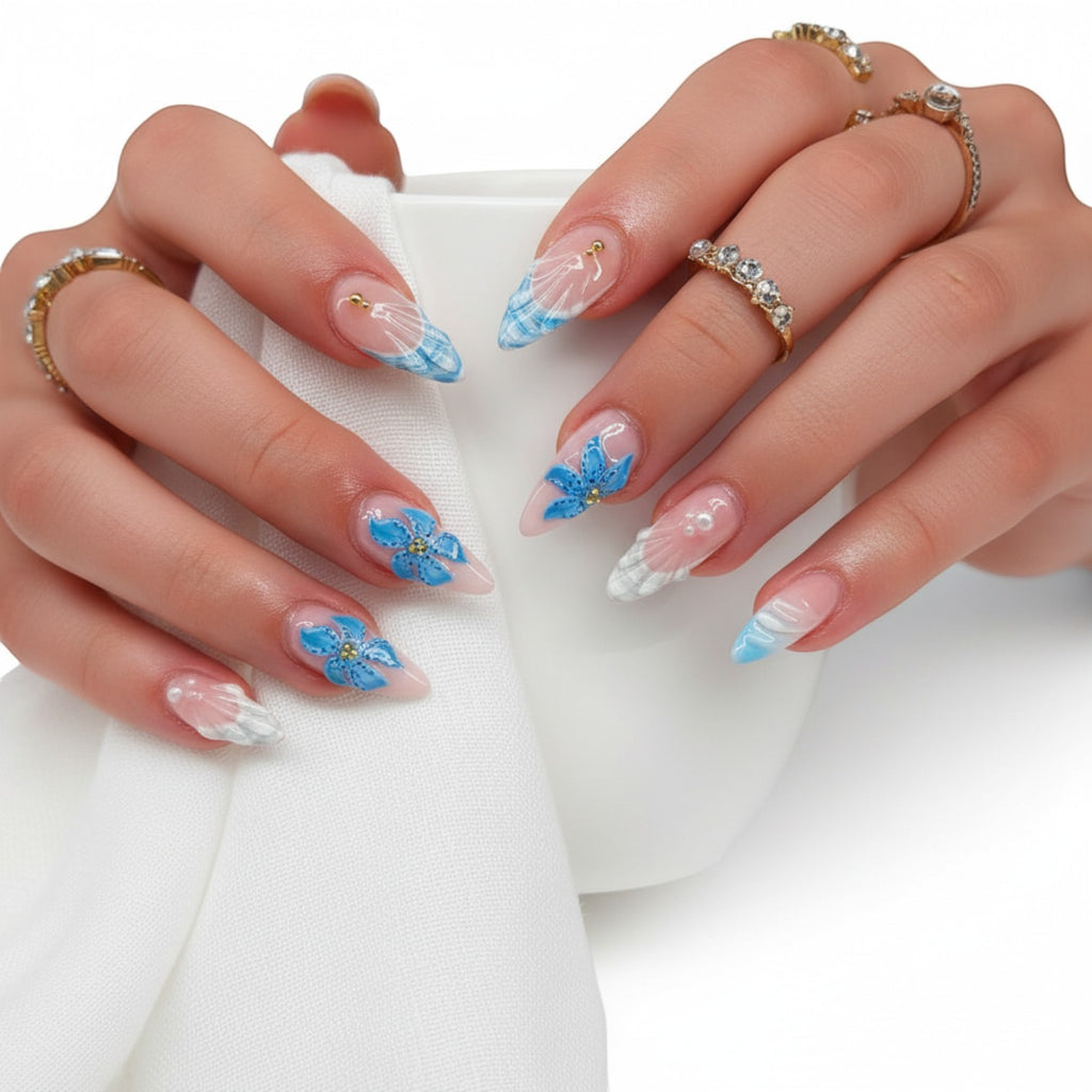 AuraPal Press Aura24 press-on nails with blue floral and plaid designs. Almond shape, glossy finish.
