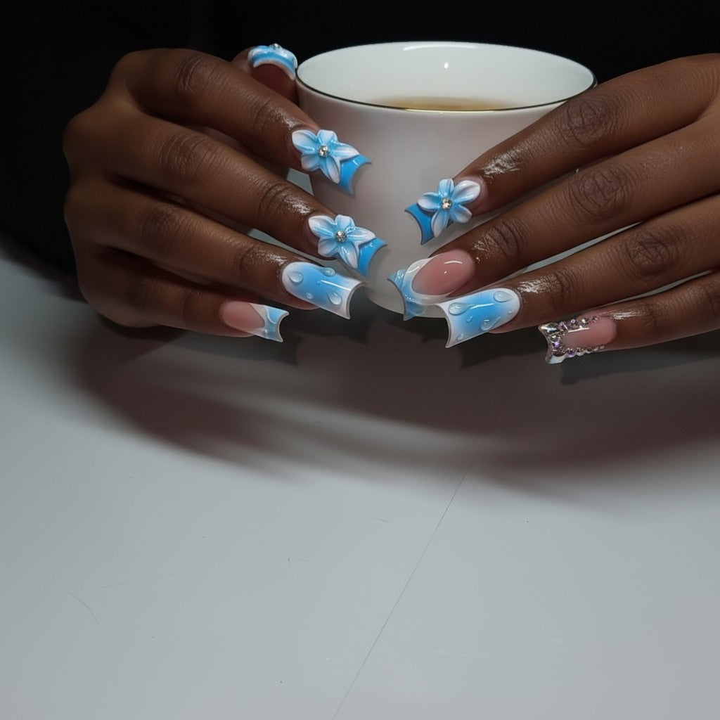 Aurapal Press Aura64 blue and white water drop press-on nails with 3D flowers and rhinestones.