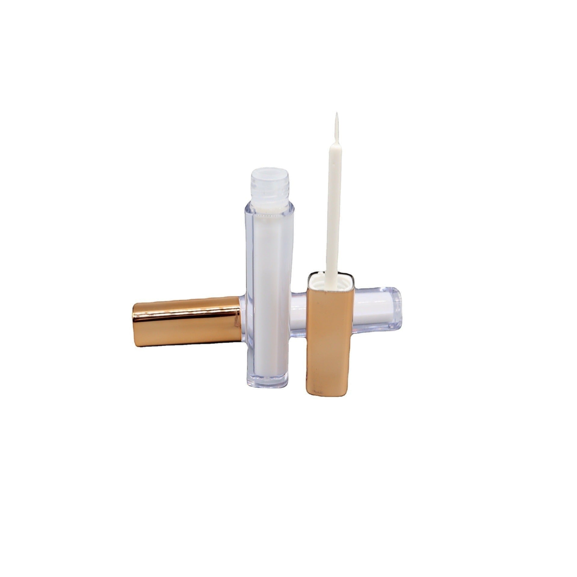 Aurapal professional eyelash adhesive applicator with a transparent tube, fine-tipped brush, and metallic gold cap.