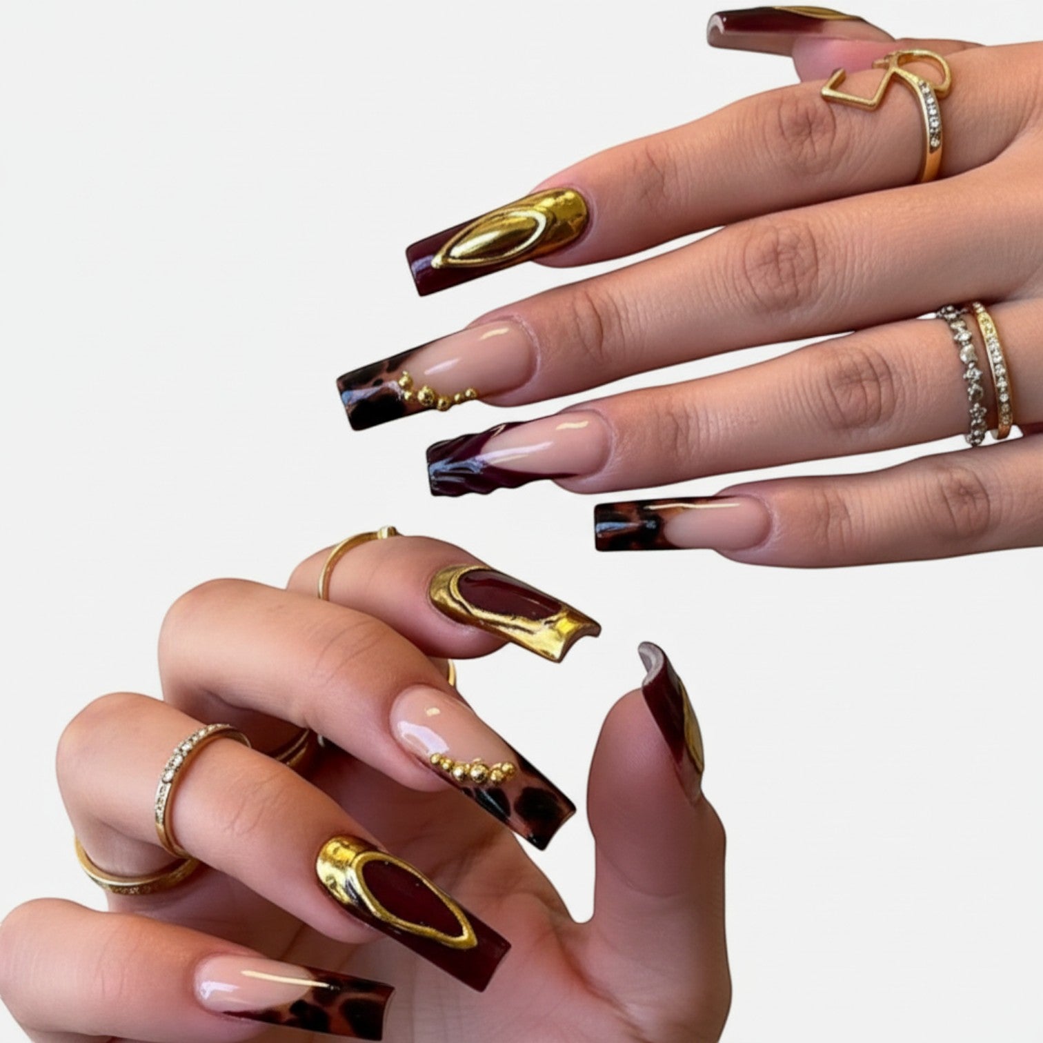 Press Aura57 by AuraPal: Long, square-shaped press-on nails with a French tip design featuring leopard print, gold accents, and deep red wavy tips.