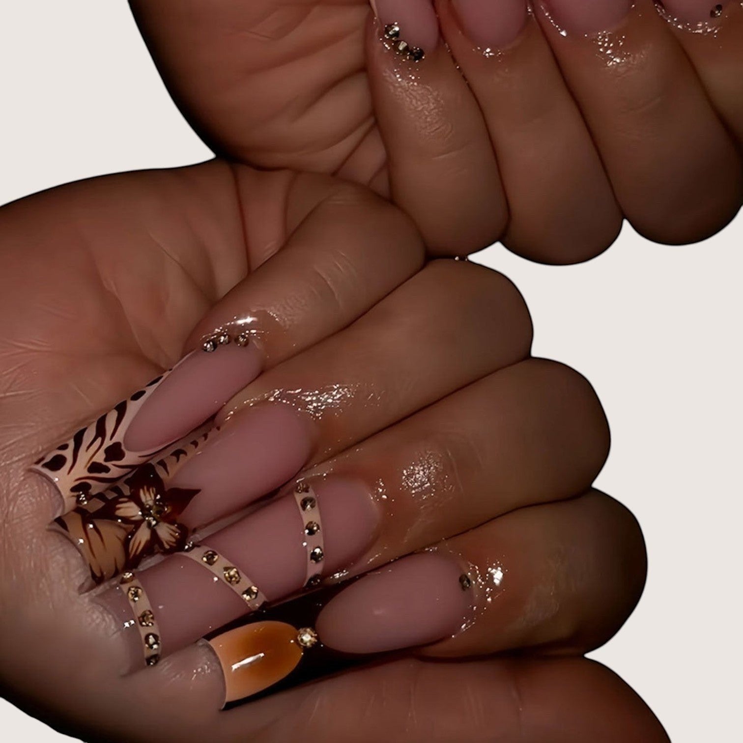 Aurapal long square press-on nails with nude base, animal print, floral motifs, and rhinestone embellishments.