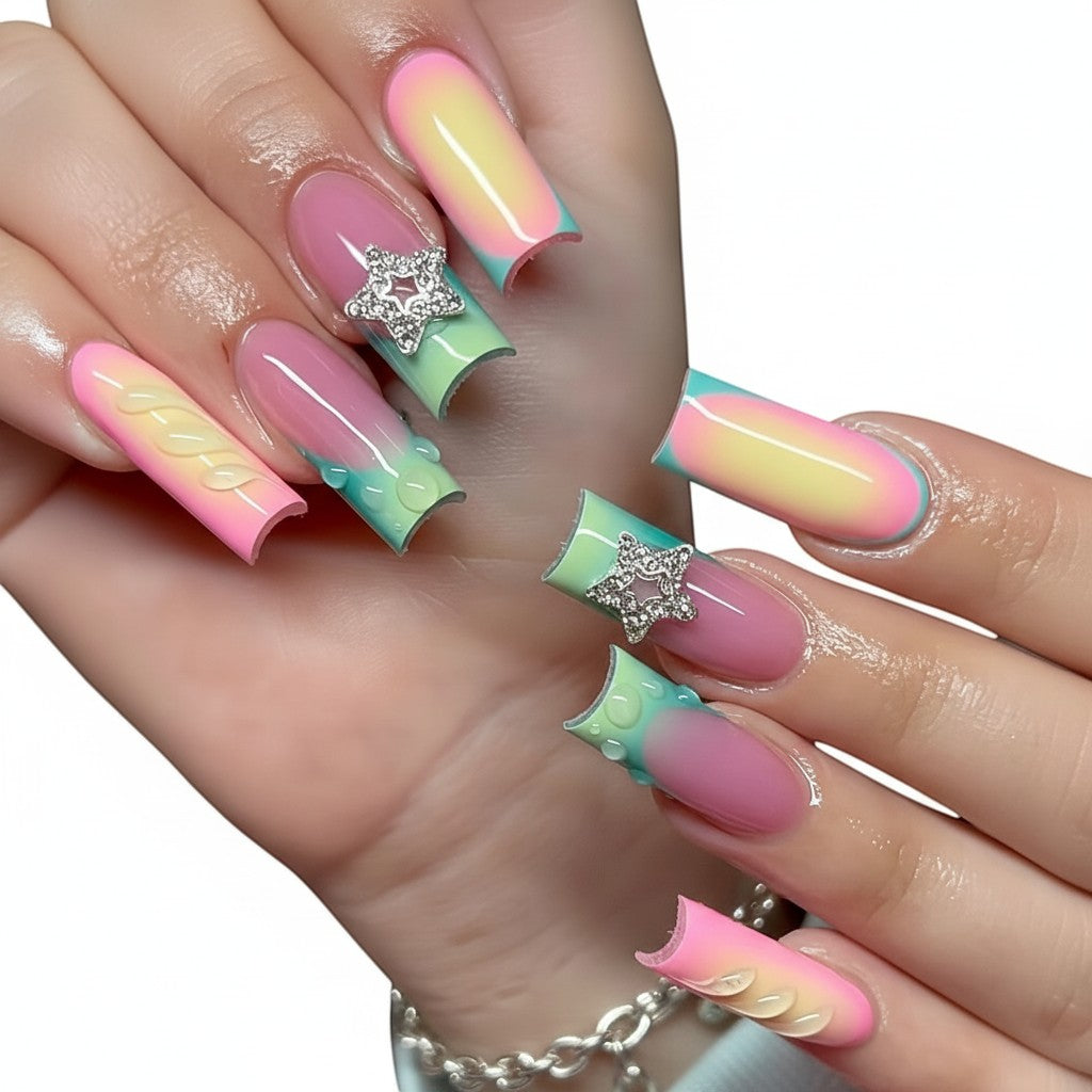 AuraPal Aura68 press-on nails with pink, green, and yellow ombre design, 3D water droplets, and star charms.