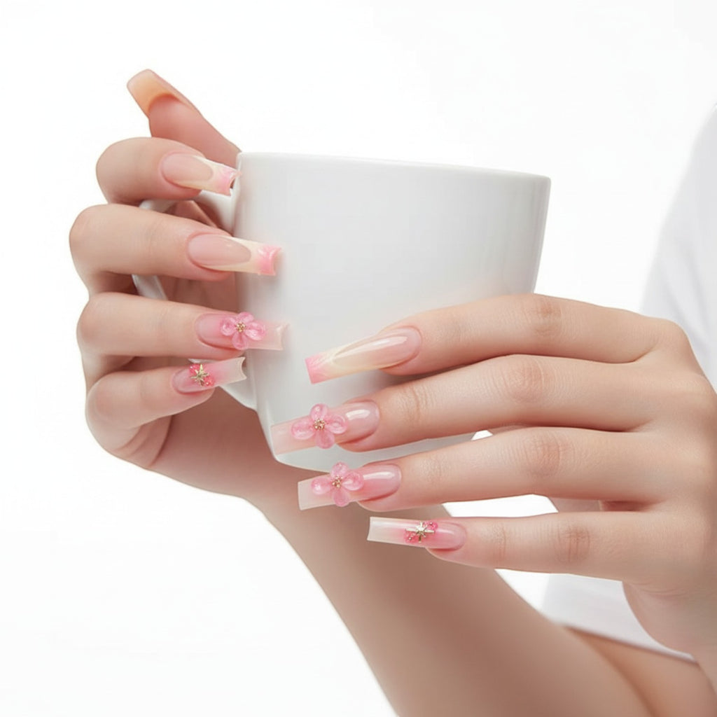 Aurapal Aura49 long square press-on nails with pink French tips and 3D floral embellishments.