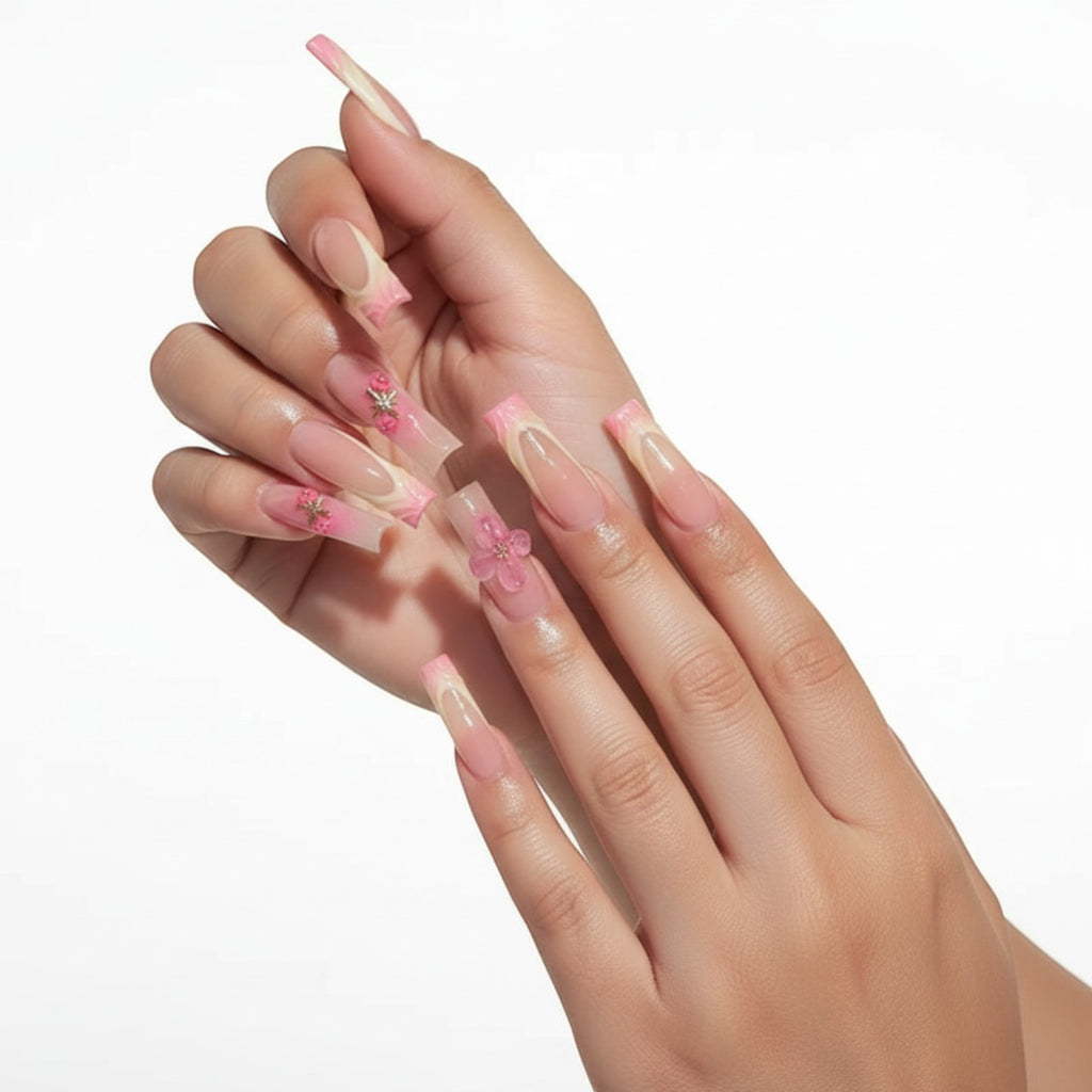 Aurapal Aura49 long square press-on nails with pink floral 3D embellishments and French tip design.