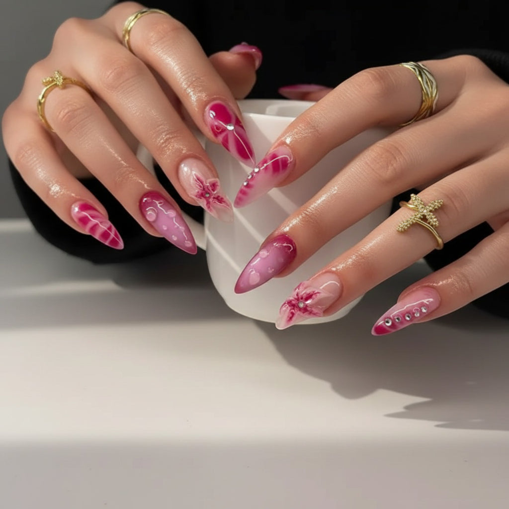 Aurapal Aura40 pink ombre stiletto press-on nails with 3D floral accents and rhinestones.