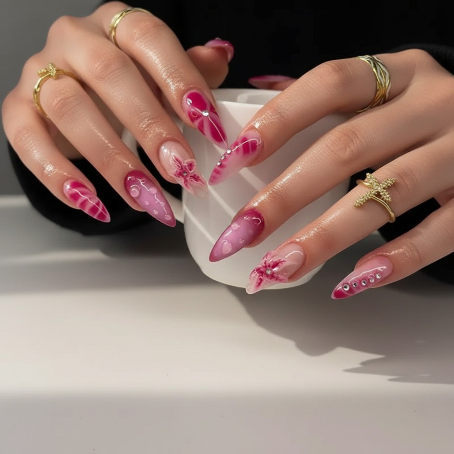 Aurapal Aura40 pink ombre stiletto press-on nails with 3D floral accents and rhinestones.