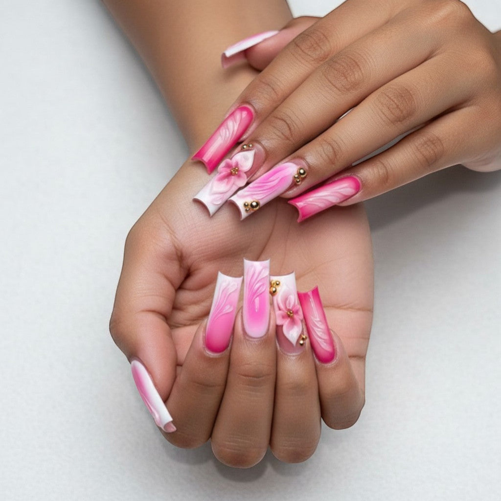 Aurapal Aura22 long press-on nails with pink ombre, white French tips, 3D flowers, and gold beads.