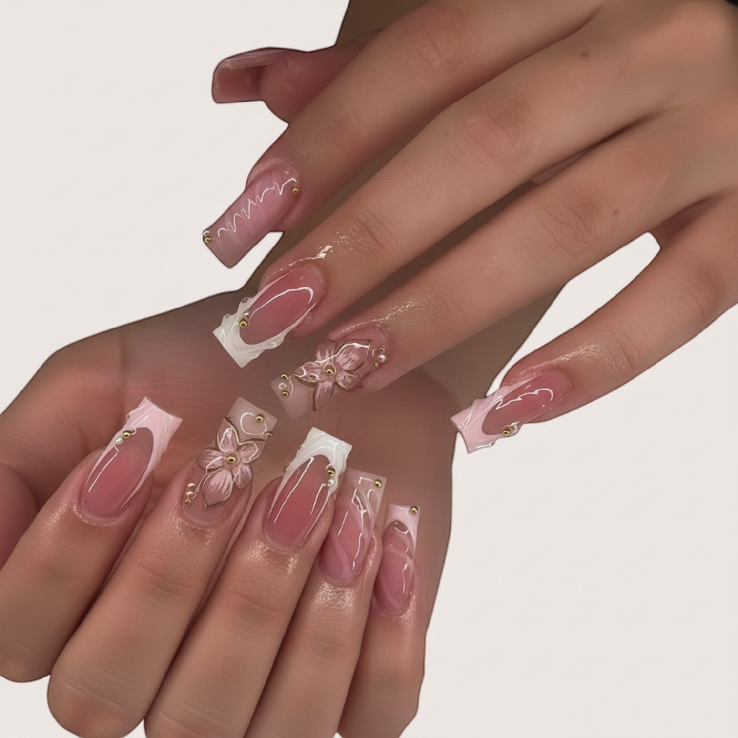 Aura50 press-on nails with pink and clear design, 3D flower accent, and gold bead details. Square shape.