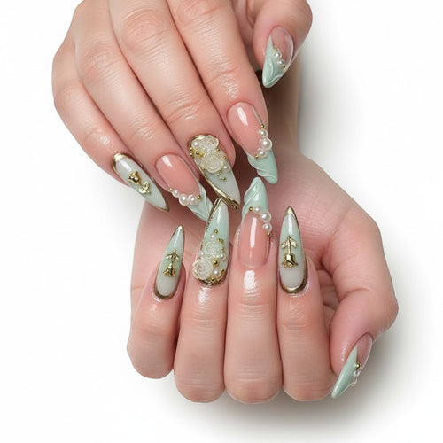 AuraPress Aura19 press-on nails with pink and mint green French tips, adorned with pearls, gold accents, and rose charms.
