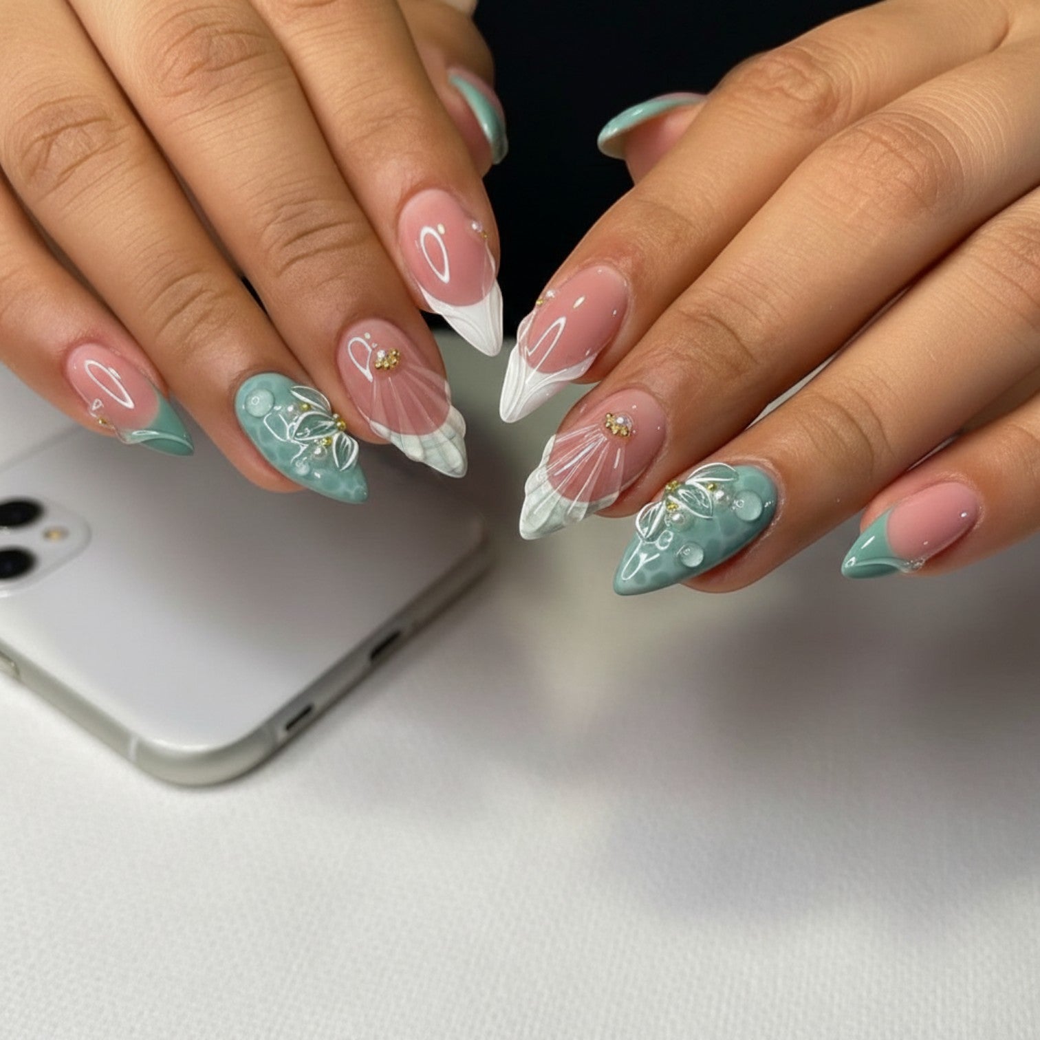 AuraPress Aura37 press-on nails in a mint green and pink French tip design with 3D floral and water drop embellishments.