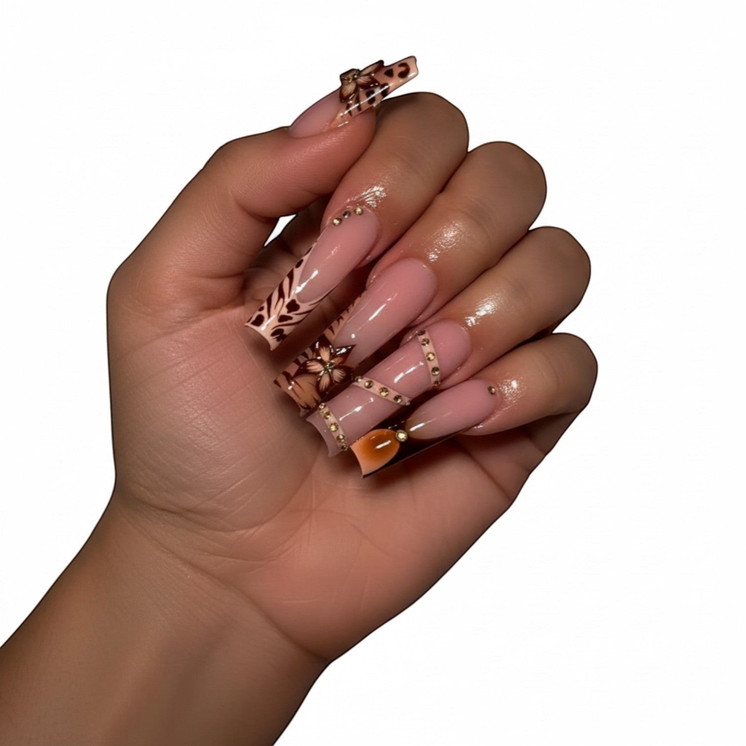 Aurapal Press Aura53 long coffin press-on nails with French tips, rhinestones, and animal print accents.
