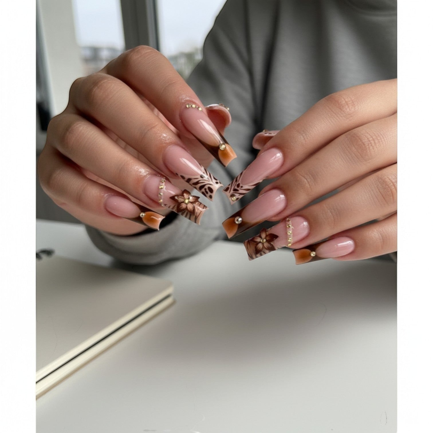 Aurapal Press Aura53 long coffin press-on nails with French tip, rhinestones, leopard print, and floral design.