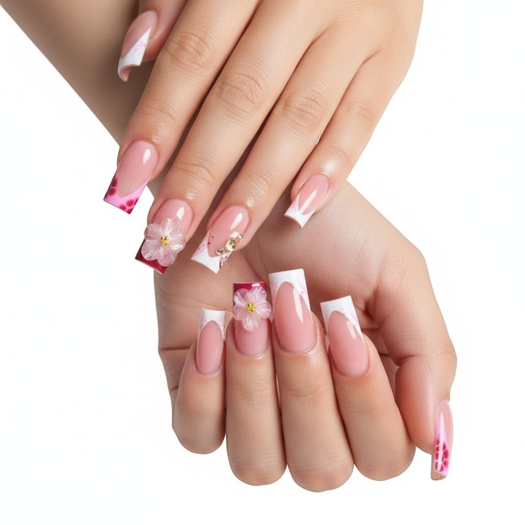 Aurapal Press Aura60 French tip press-on nails with pink floral accents and rhinestones.