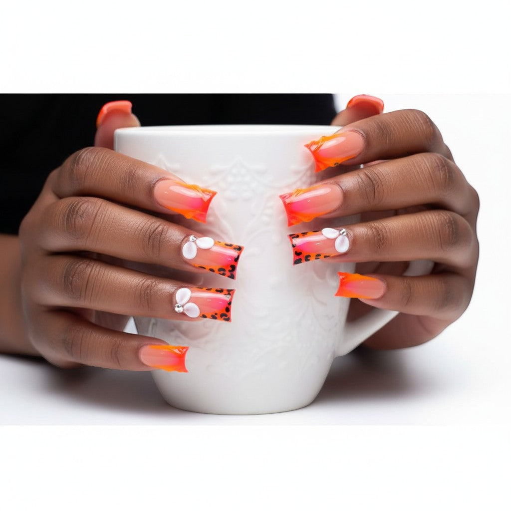 AuraPal Press Aura63 long square press-on nails with neon orange French tips, leopard print, and 3D flower accents.