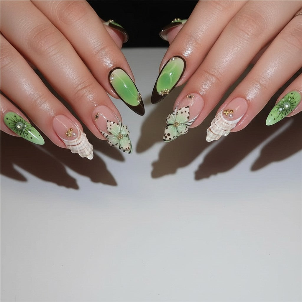 AuraPress25 press-on nails with green ombre, butterfly, and seashell designs. Features gold accents and pearls.