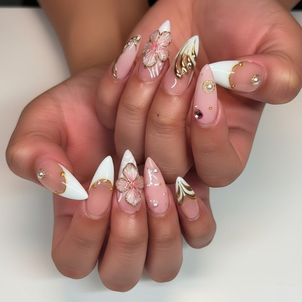 Aurapal Aura41 press-on nails with pink floral 3D accents, gold details, and pearl embellishments on a light pink and white French tip.