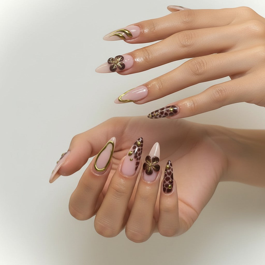 Aurapal Aura67 stiletto press-on nails with pink base, brown animal print, gold accents, and 3D flowers.