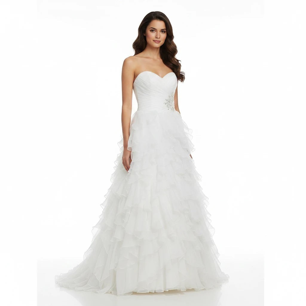 Aurapal strapless white tulle wedding gown with a ruched sweetheart bodice, crystal waist accent, and ruffled skirt.