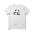 Aurapal white crewneck t-shirt featuring It is never too late text in black script with purple butterfly accents.