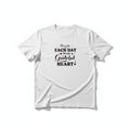 Aurapal white crewneck t-shirt featuring black typography and red heart accents with the text Begin Each Day With A Grateful Heart.