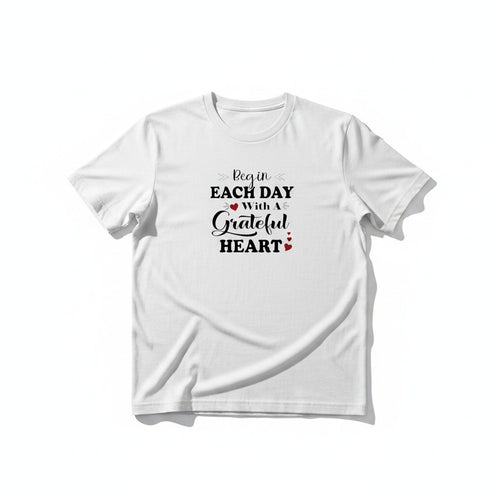 Aurapal white crewneck t-shirt featuring black typography and red heart accents with the text Begin Each Day With A Grateful Heart.